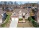 Stunning aerial view of a beautiful two-story brick home with a well-manicured lawn at 10016 Porto Fino Ave, Wake Forest, NC 27587
