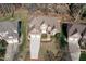 Impressive aerial view of a well-maintained home, featuring a manicured lawn and mature trees at 10016 Porto Fino Ave, Wake Forest, NC 27587