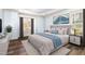 Comfortable bedroom with large windows, neutral tones, and stylish decor at 10016 Porto Fino Ave, Wake Forest, NC 27587