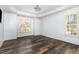 Bright bedroom features hardwood floors, plantation shutters, and neutral paint at 10016 Porto Fino Ave, Wake Forest, NC 27587