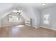 Bright and open bedroom with hardwood flooring and built-in media center at 10016 Porto Fino Ave, Wake Forest, NC 27587