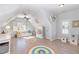 Bright bedroom featuring hardwood floors, built in reading nook, and window seat at 10016 Porto Fino Ave, Wake Forest, NC 27587