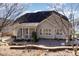 Back of house featuring patio, sunroom, and landscaped yard at 10016 Porto Fino Ave, Wake Forest, NC 27587