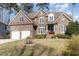 Beautiful two-story brick home featuring a two-car garage and landscaped yard at 10016 Porto Fino Ave, Wake Forest, NC 27587