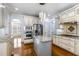 Bright kitchen featuring granite countertops, stainless steel appliances, and custom cabinetry at 10016 Porto Fino Ave, Wake Forest, NC 27587