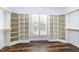 Spacious walk-in closet with custom shelving and a window at 10016 Porto Fino Ave, Wake Forest, NC 27587