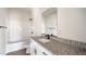 Bathroom features granite countertop with sink and shower-tub combo at 1012 W Webb Ave, Burlington, NC 27217