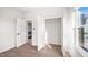 Bedroom with new vinyl floors, closet, and a window that allows natural light at 1012 W Webb Ave, Burlington, NC 27217