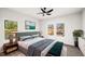 Comfortable bedroom featuring a ceiling fan, stylish decor, and ample natural light at 1012 W Webb Ave, Burlington, NC 27217
