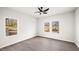 Bright bedroom featuring two windows and sleek flooring at 1012 W Webb Ave, Burlington, NC 27217
