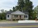 Charming home with gray siding, covered porch, and newly paved driveway at 1012 W Webb Ave, Burlington, NC 27217
