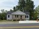 Charming single-story home featuring a new front porch and a freshly paved driveway at 1012 W Webb Ave, Burlington, NC 27217
