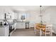 Eat-in kitchen with white cabinets, granite countertops, and stainless steel appliances at 1012 W Webb Ave, Burlington, NC 27217