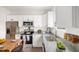 Kitchen featuring granite countertops, stainless steel appliances, and ample cabinet space at 1012 W Webb Ave, Burlington, NC 27217