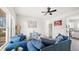 Comfortable living room with blue sofas and natural light from a large window at 1012 W Webb Ave, Burlington, NC 27217