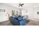 Comfortable living room featuring a plush sofa and large windows at 1012 W Webb Ave, Burlington, NC 27217