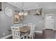 Charming dining area with unique wall décor and a cozy atmosphere at 1026 Burlington Rd, Roxboro, NC 27573