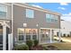 Exterior view showcasing neutral siding and a covered back patio perfect for outdoor entertaining at 1029 Benay Rd, Morrisville, NC 27560
