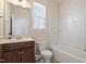 Bright bathroom featuring a tub/shower combo and a vanity with storage at 1029 Benay Rd, Morrisville, NC 27560