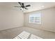 Spacious bedroom with a ceiling fan, carpeted floor, and natural light at 1029 Benay Rd, Morrisville, NC 27560