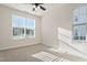 Sunlit bedroom with neutral carpet and large windows providing natural light at 1029 Benay Rd, Morrisville, NC 27560