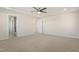 Spacious bedroom featuring neutral carpet, ceiling fan, and access to an en-suite bathroom at 1029 Benay Rd, Morrisville, NC 27560
