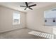Bright bedroom with carpet, a ceiling fan, and windows allowing natural light at 1029 Benay Rd, Morrisville, NC 27560