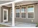 Covered patio showcasing neutral siding, a fan, and a seamless indoor-outdoor living space at 1029 Benay Rd, Morrisville, NC 27560