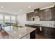 Spacious kitchen with granite island, dark cabinetry, and stainless steel appliances at 1029 Benay Rd, Morrisville, NC 27560