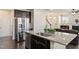 Kitchen island with stainless steel appliances and granite countertops at 1029 Benay Rd, Morrisville, NC 27560