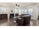 Bright living room with hardwood floors, fireplace, and comfortable leather seating at 1029 Benay Rd, Morrisville, NC 27560