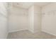 A walk-in closet with carpet, white walls, and shelving for ample storage at 1029 Benay Rd, Morrisville, NC 27560