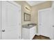 This bathroom features a granite countertop and wood-look flooring at 1076 Nc 55, Coats, NC 27521
