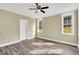 This bedroom has two windows and a ceiling fan at 1076 Nc 55, Coats, NC 27521