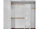 A closet has wood clothing rods and built-in shelving at 1076 Nc 55, Coats, NC 27521