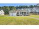 An inviting single-story home boasts a two-car garage and well-maintained landscaping at 1076 Nc 55, Coats, NC 27521