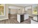Stylish kitchen with an island and stainless steel dishwasher in an open-concept layout at 1076 Nc 55, Coats, NC 27521