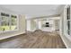 Spacious living area with large windows providing plenty of natural light at 1076 Nc 55, Coats, NC 27521