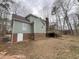 View of the home's backyard showcasing the wooden deck and the home's exterior at 1116 Shadywood Ln, Raleigh, NC 27603