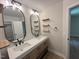Modern bathroom featuring a double sink vanity and stylish mirrors at 1116 Shadywood Ln, Raleigh, NC 27603