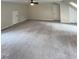 Spacious bedroom featuring neutral carpet, ceiling fan, and a double door closet at 1116 Shadywood Ln, Raleigh, NC 27603