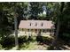 Aerial view of a charming home surrounded by lush trees, offering a private and serene setting at 1116 Shadywood Ln, Raleigh, NC 27603
