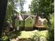 Exterior view of home with back deck and green lawn at 1116 Shadywood Ln, Raleigh, NC 27603
