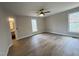Spacious main bedroom with vinyl floors, a ceiling fan, and access to an ensuite bathroom at 1116 Shadywood Ln, Raleigh, NC 27603
