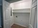 Clean walk-in pantry with bright white walls and shelving at 1116 Shadywood Ln, Raleigh, NC 27603