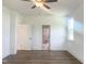 Spacious bedroom featuring wood-look floors, a ceiling fan, and a window providing natural light at 114 Tee Time Ter, Benson, NC 27504