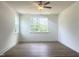 A bedroom with bright natural light, hard surface floors, and white walls at 114 Tee Time Ter, Benson, NC 27504