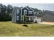 Charming two-story home featuring blue siding, a two-car garage, and a well-maintained lawn at 114 Tee Time Ter, Benson, NC 27504