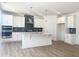 Bright kitchen featuring white cabinets, stainless steel appliances, and a stylish island at 114 Tee Time Ter, Benson, NC 27504