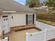 View of the home's rear exterior and fenced-in yard at 1146 Blue Bird Ln, Wake Forest, NC 27587